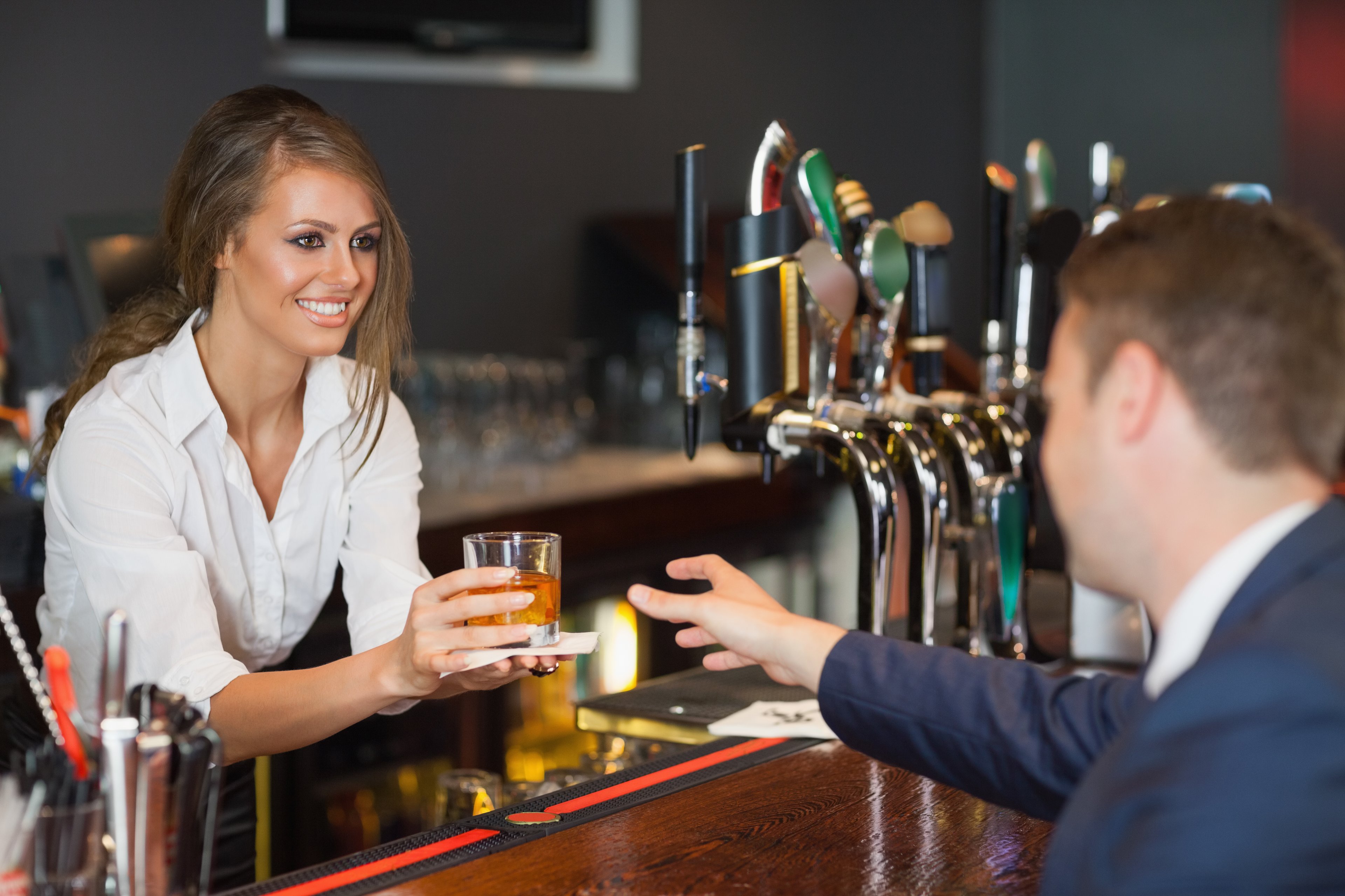 bartender serving a drink