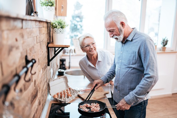 Man cooking bacon.