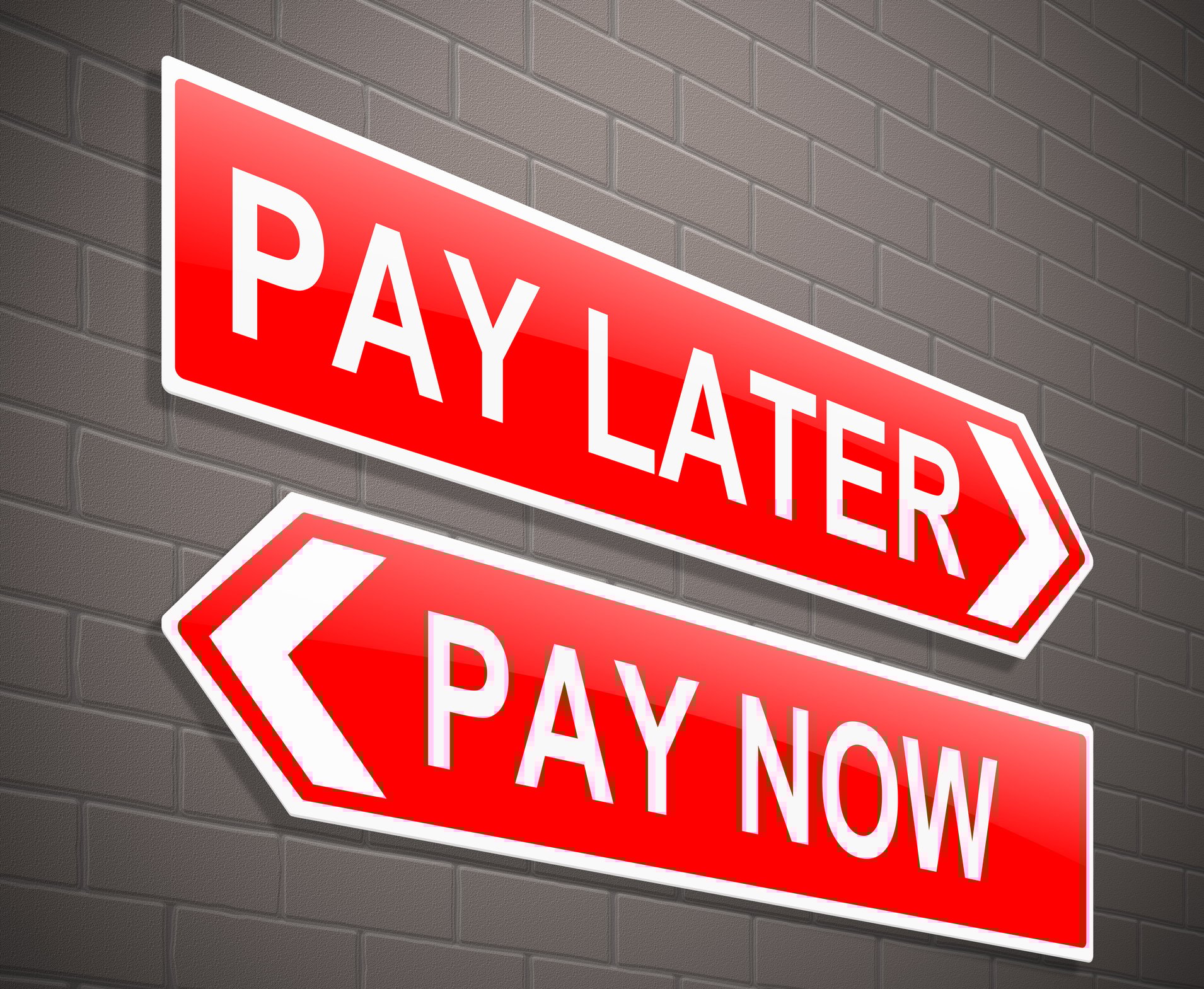2 signs on a wall that say pay later and pay now