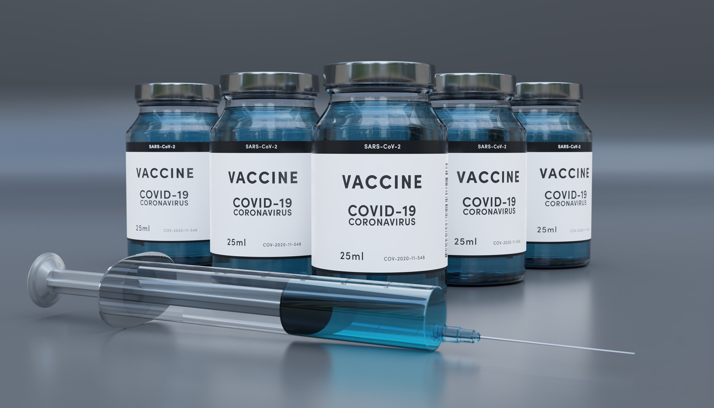 Syringe with vials marked COVID-19 Vaccine