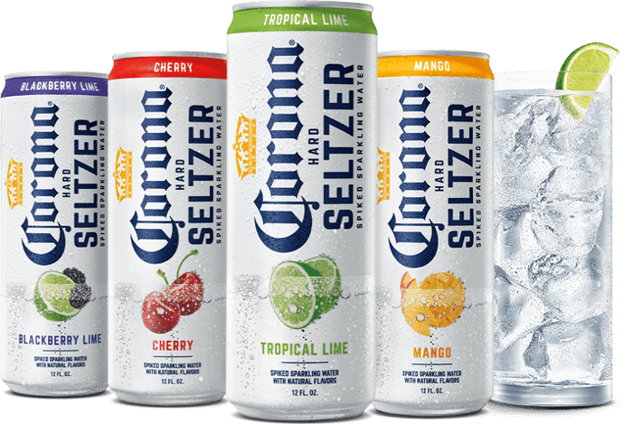 Four cans of Corona Hard Seltzer next to a glass filled with ice and seltzer 