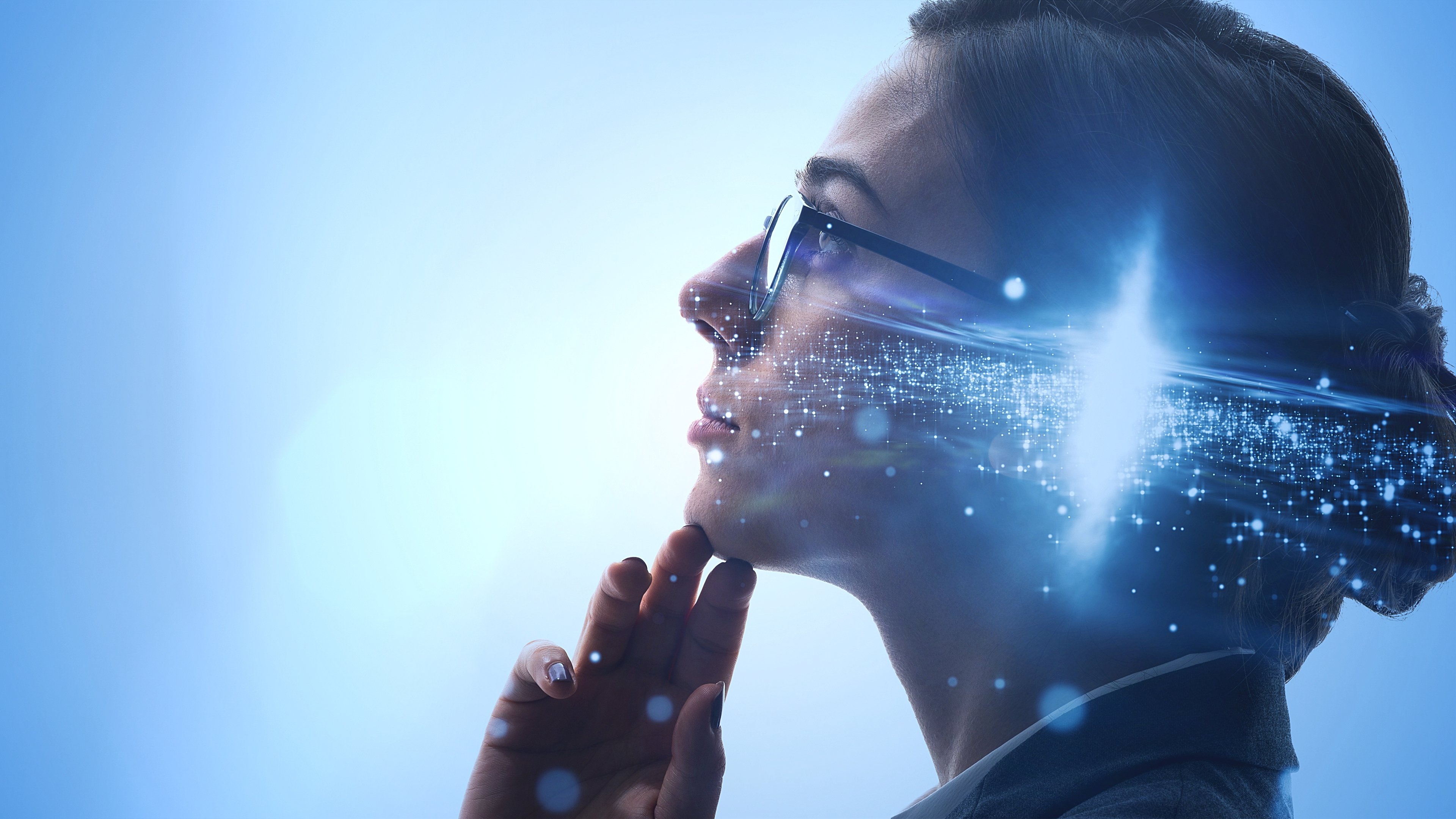 Thoughtful-looking woman with light around head 
