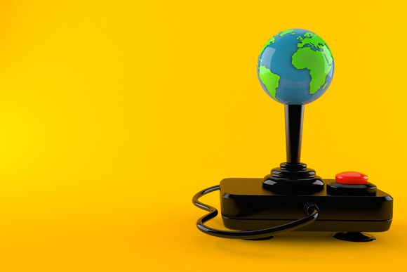 A video game controller with a globe on the joystick.