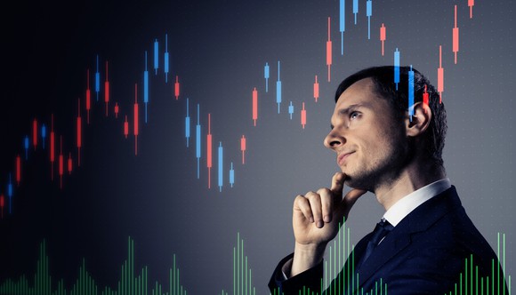 A pensive businessman with a stock chart going up and to the right overlaid.