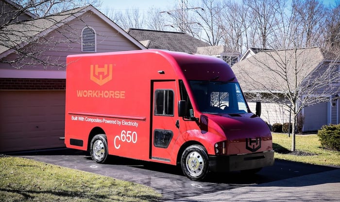 A red Workhorse C-650, an electric package-delivery van.