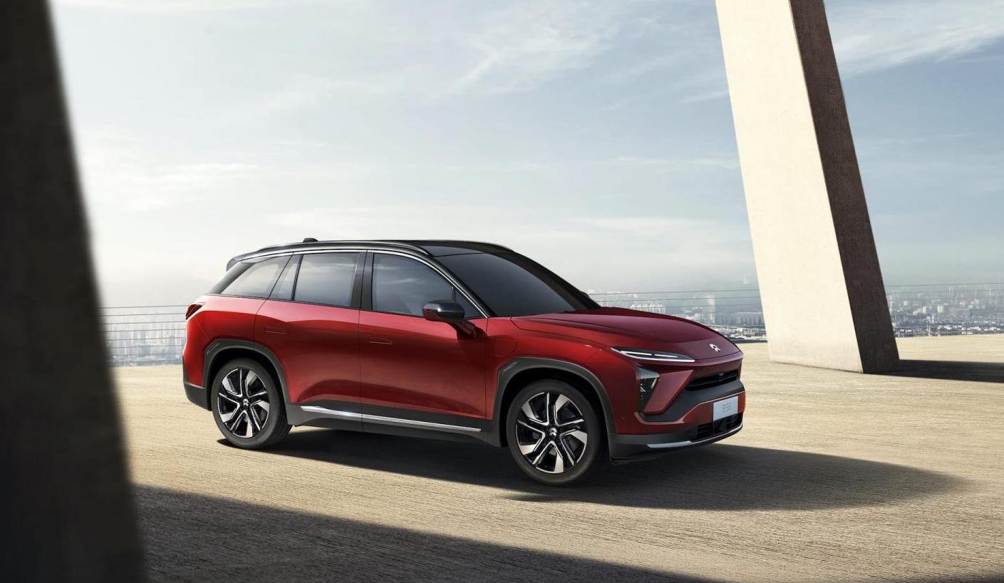 A red NIO ES6, an upscale electric two-row SUV. 