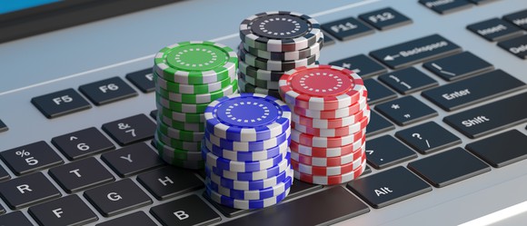 Casino chips on a PC keyboard.