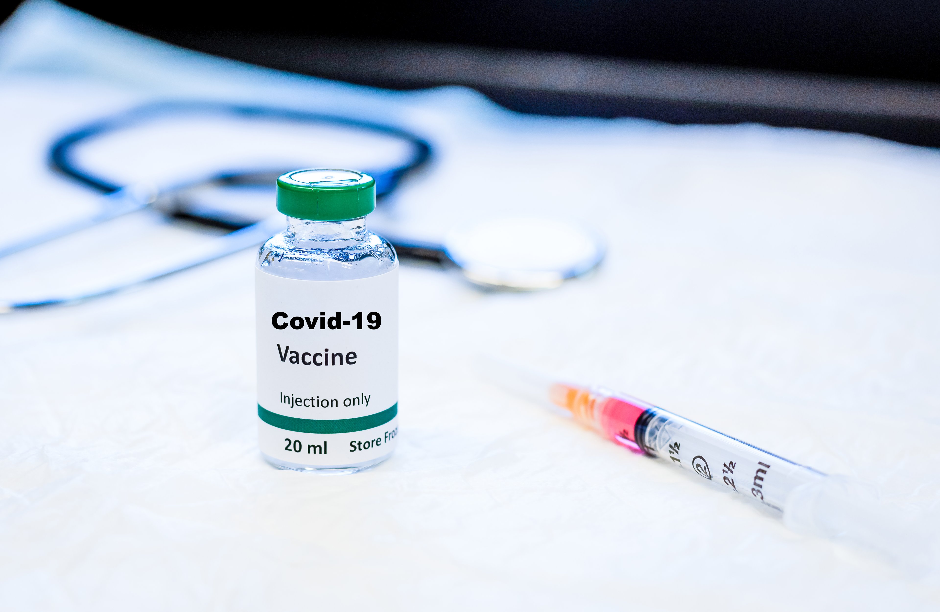 Stock photo of coronavirus vaccine vial and syringe. 
