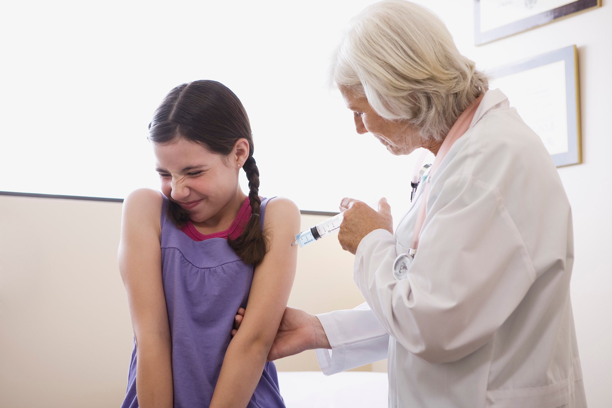 Child getting a vaccine injection.