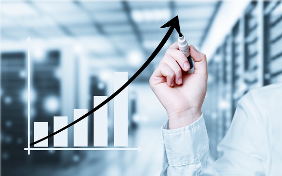 Man drawing a growth trajectory. 