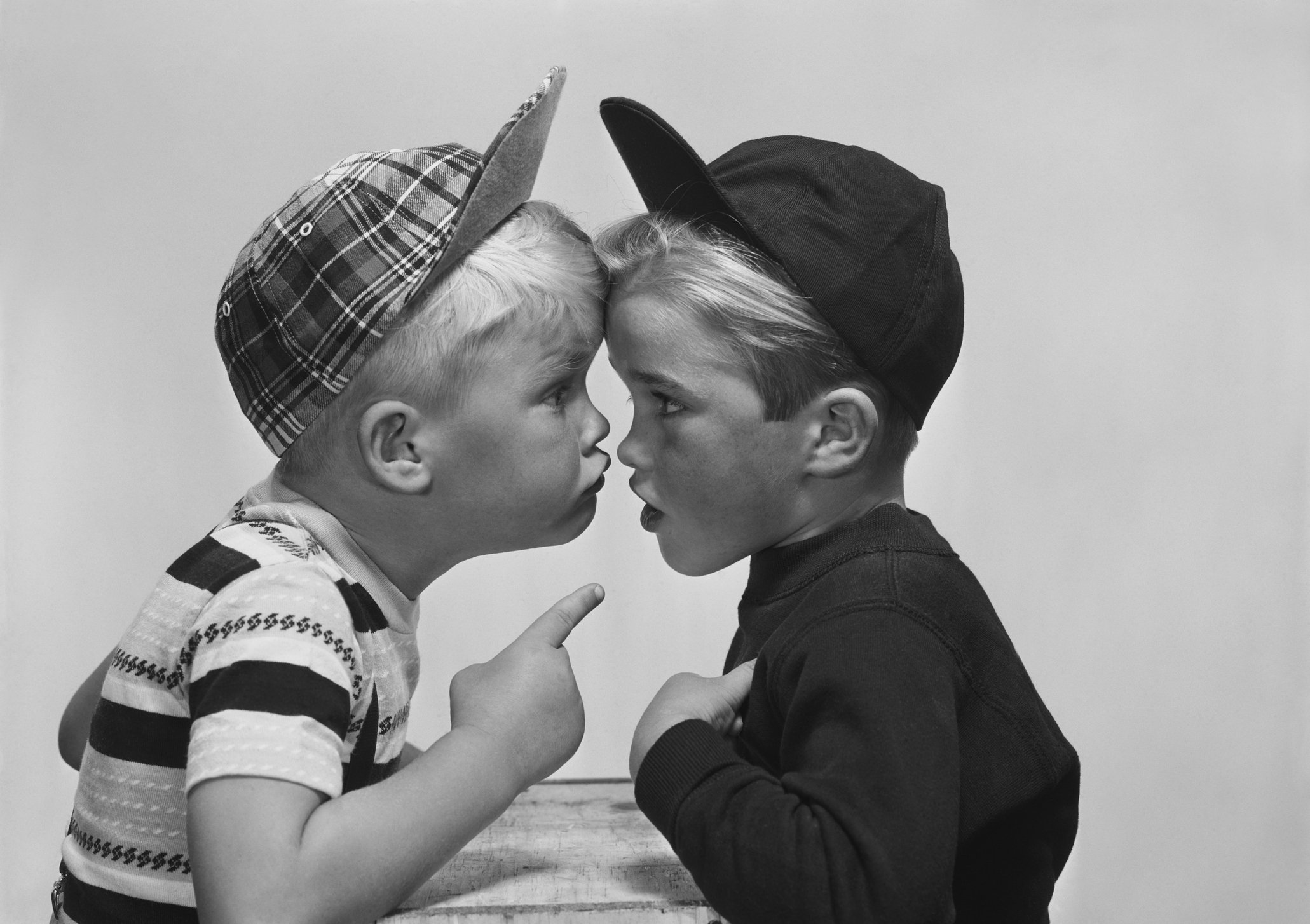 Black and white photograph of two boys in an argument.