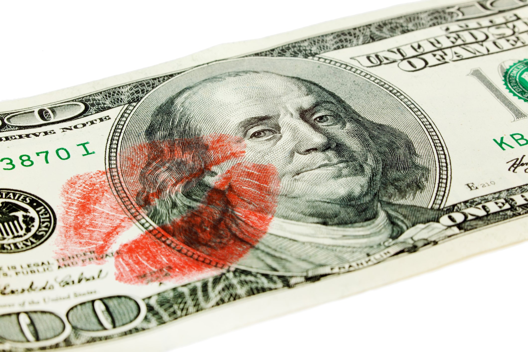 A $100 bill with a lipstick print.