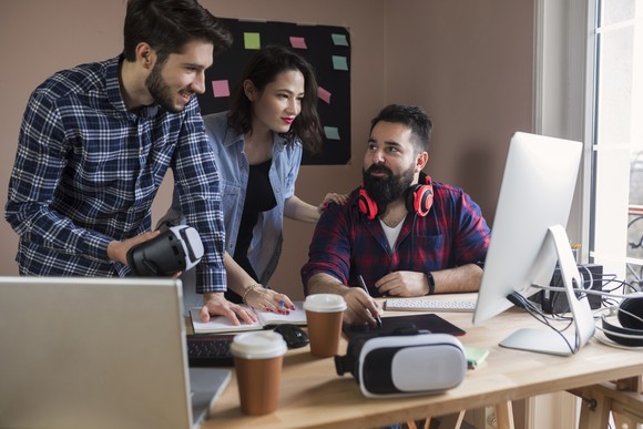 A group discussing a project in an office.