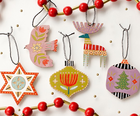 A number of hand-carved holiday ornaments.