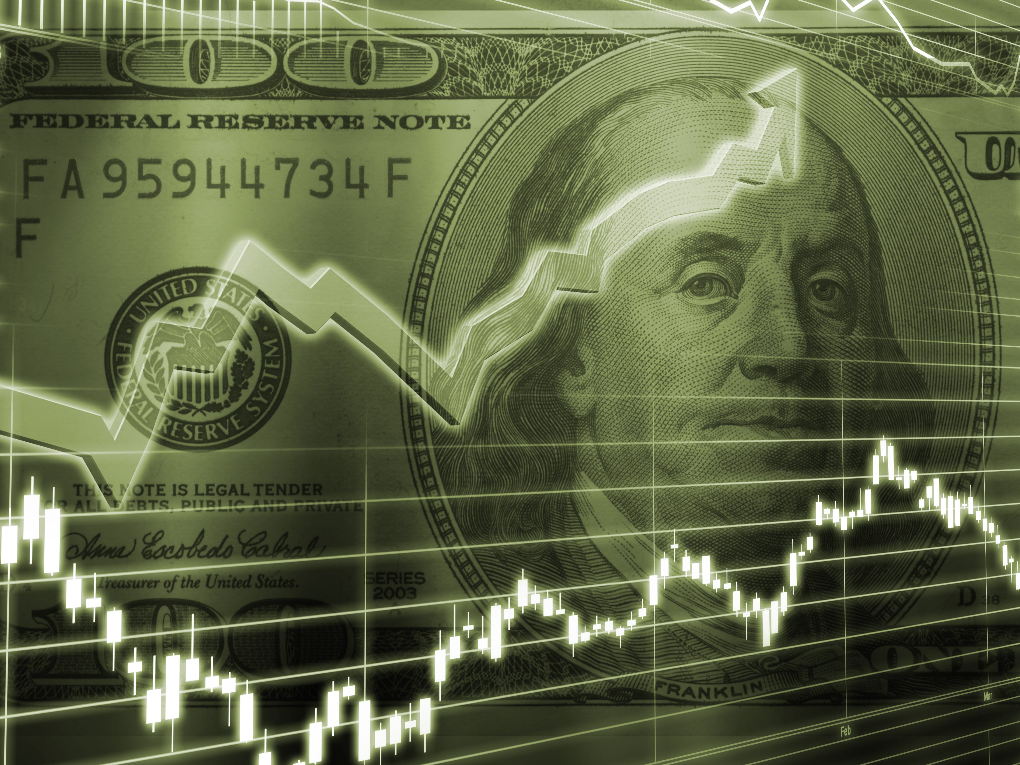 Rising stock chart on top of a dollar bill. 