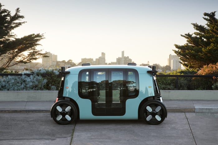 light blue driverless electric Zoox vehicle