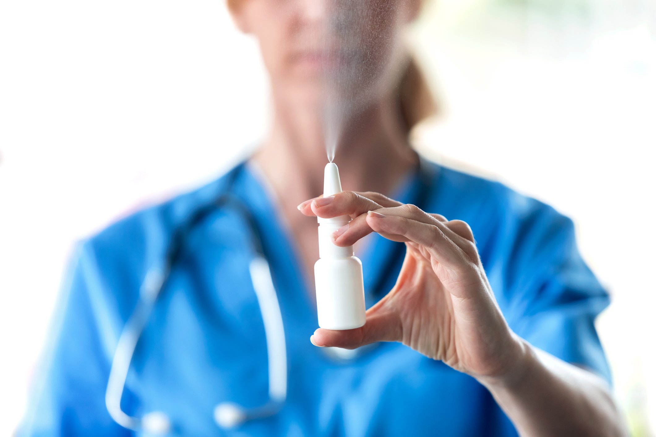 Doctor holding nasal spray bottle