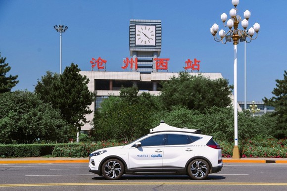 Baidu Apollo Go Robotaxi driving on the street in Cangzhou, China.