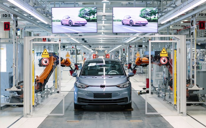 A Volkswagen ID.3 electric vehicle shown on a VW factory assembly line. 