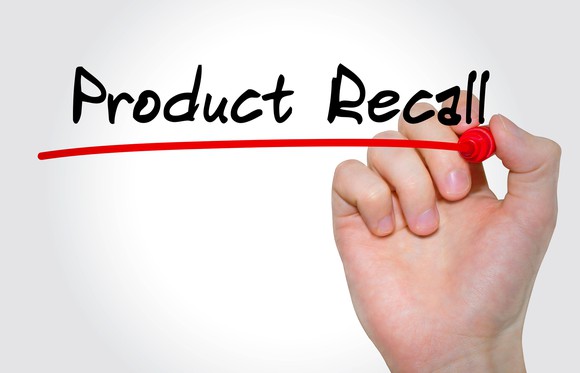 Hand holding red market next to the words "Product Recall" with a red line drawn underneath the words