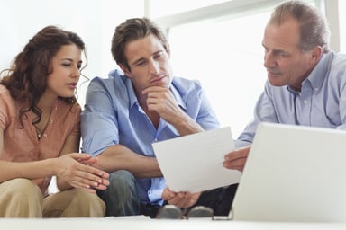 Looking_over_financial_documents.original