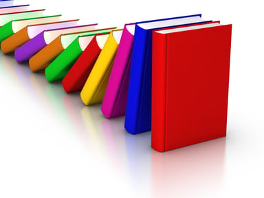 Row of colorful books falling in a domino effect