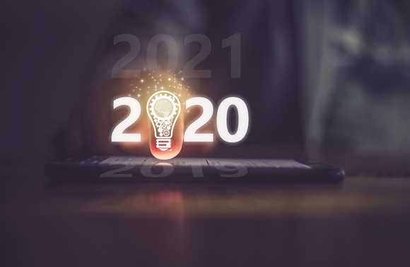 Tablet displaying 2020 sign with lightbulb as the first zero in 2020