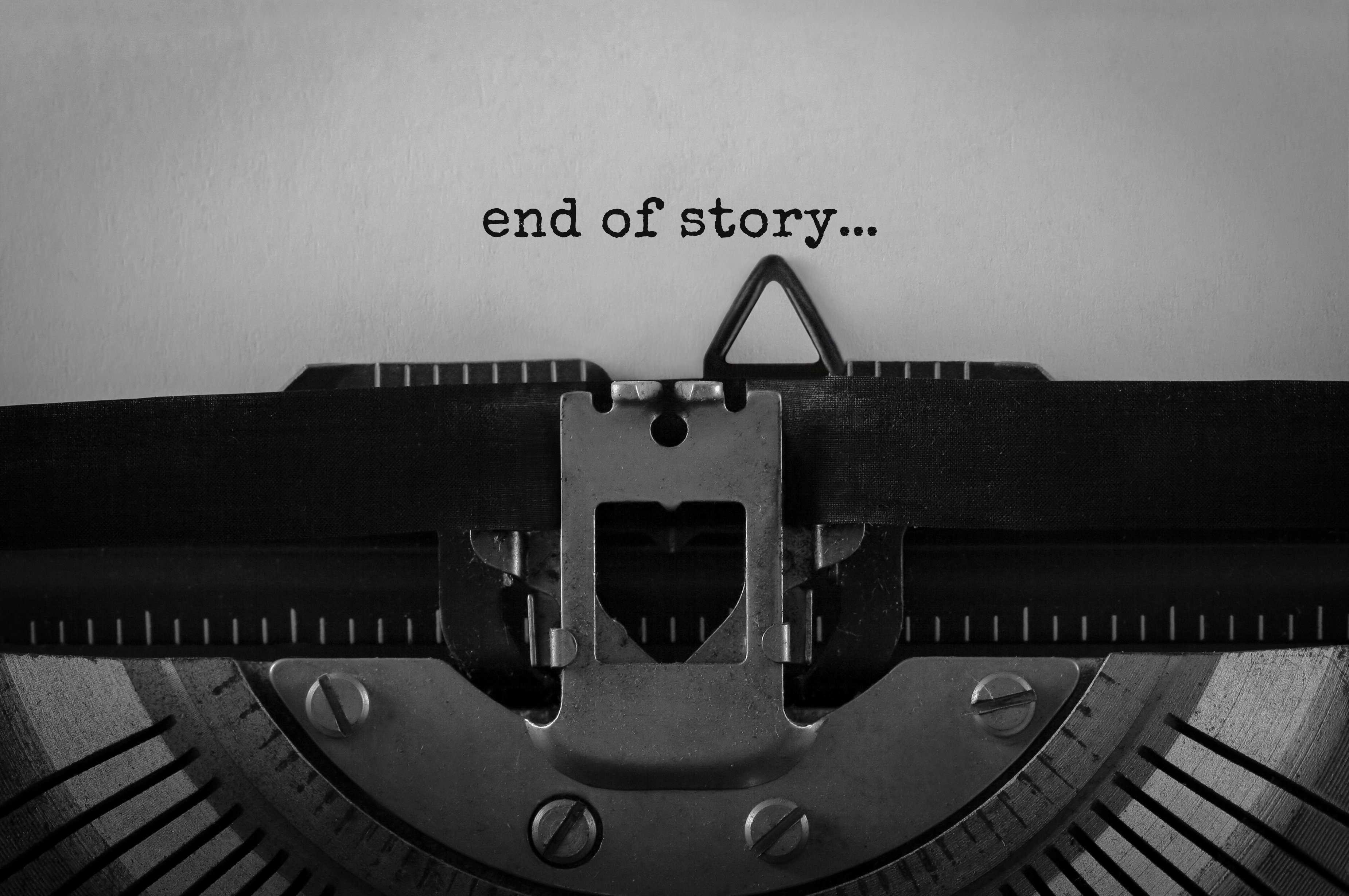 Typewriter with a paper containing only the words End of story...