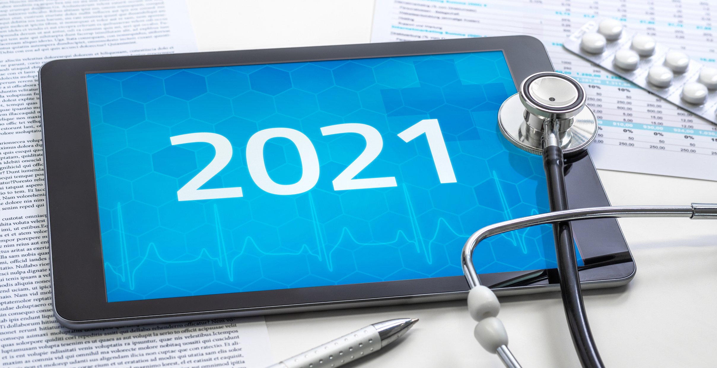 2021 displaying on a tablet with a stethoscope on top of the tablet