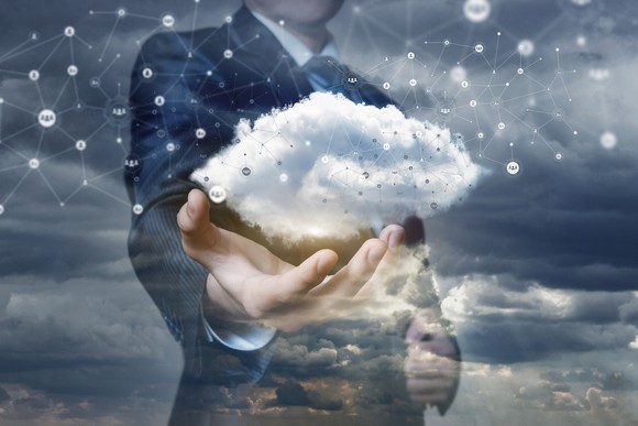 Man holding image of a cloud