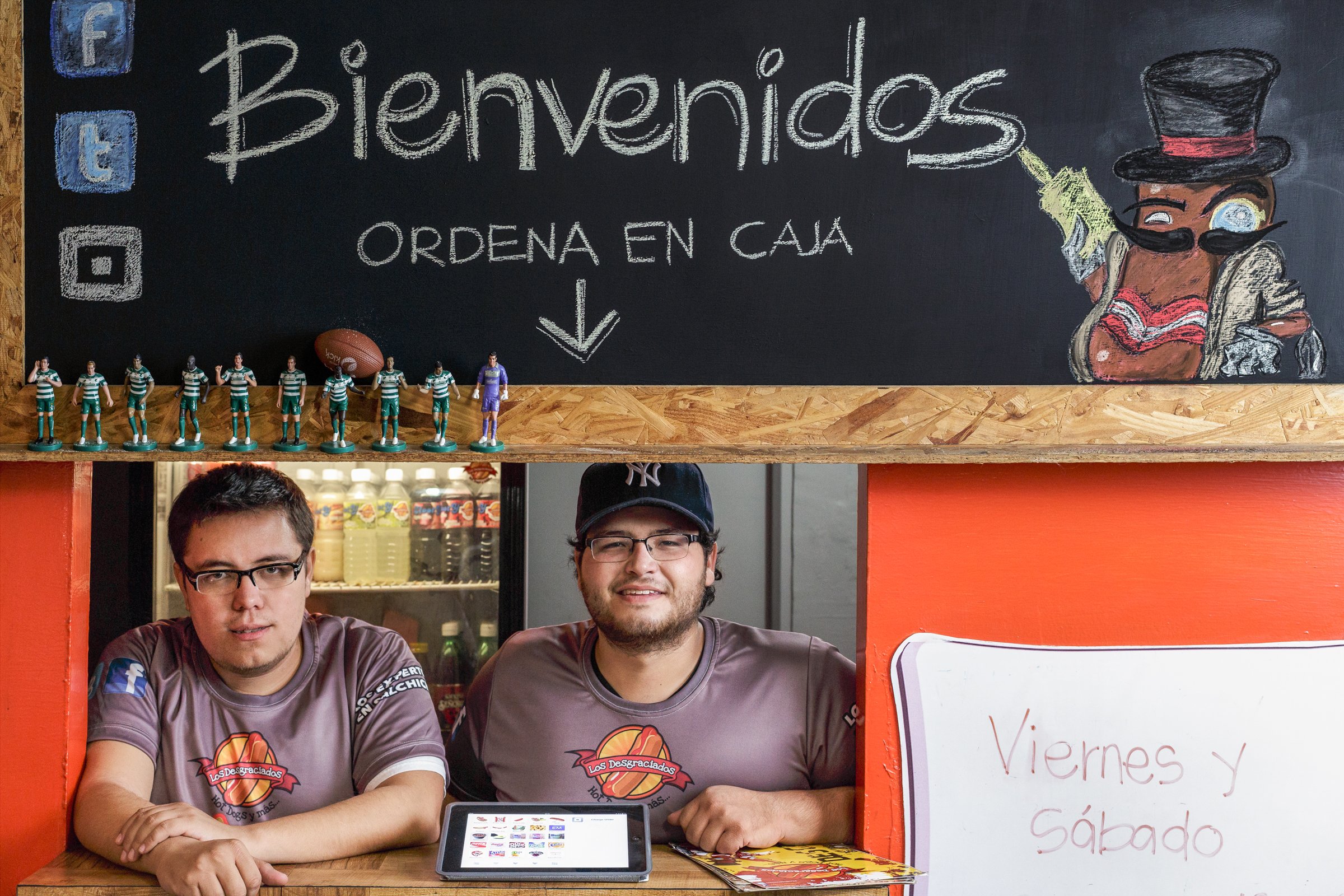 Two employees at a food service business.