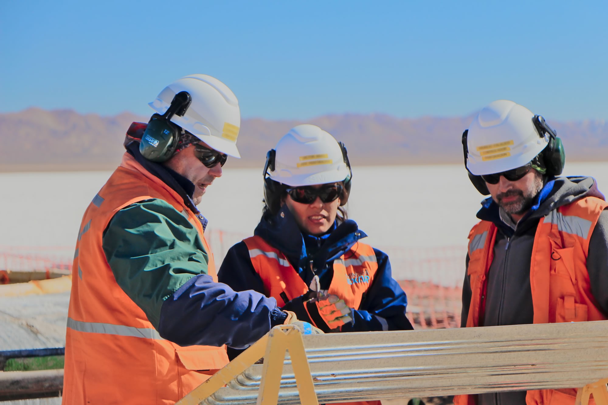 lithium americas mining workers studying field drawings. 