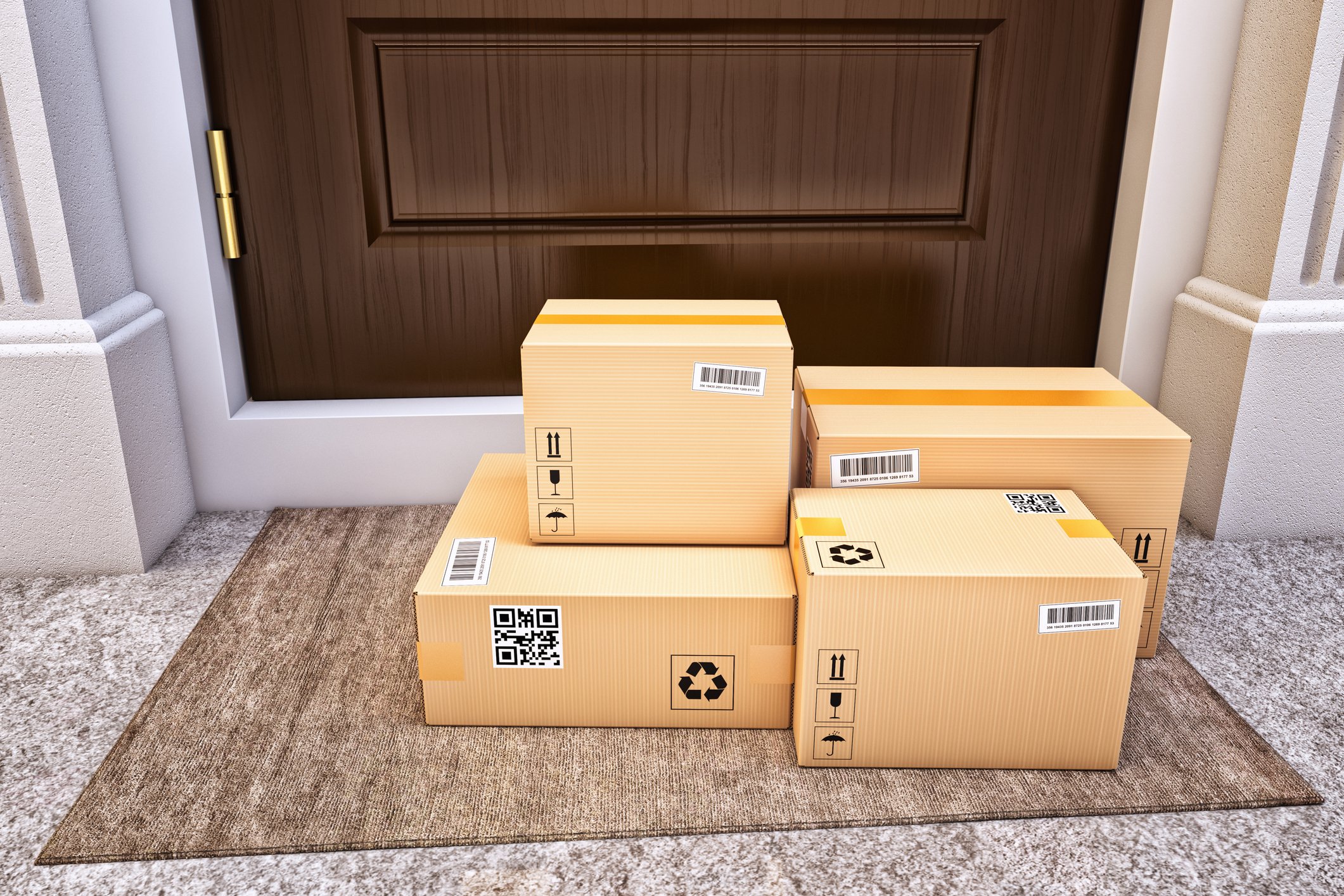 Packages stacked on the floor outside a door