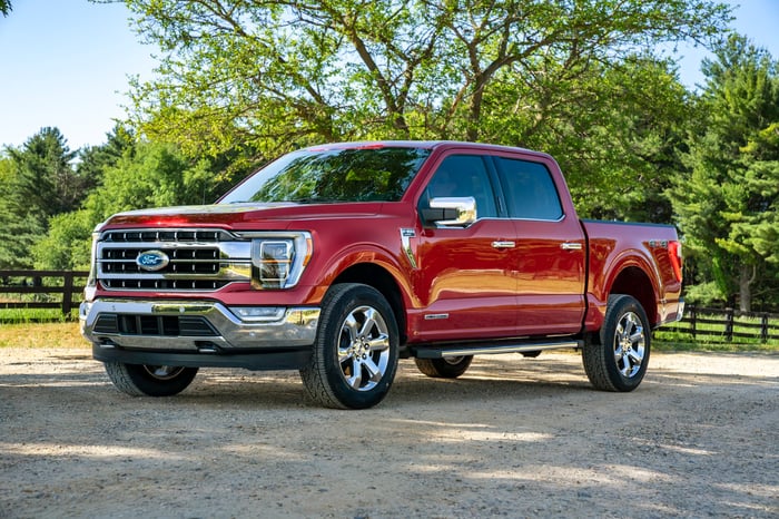 A red 2021 Ford F-150, a full size pickup truck. 