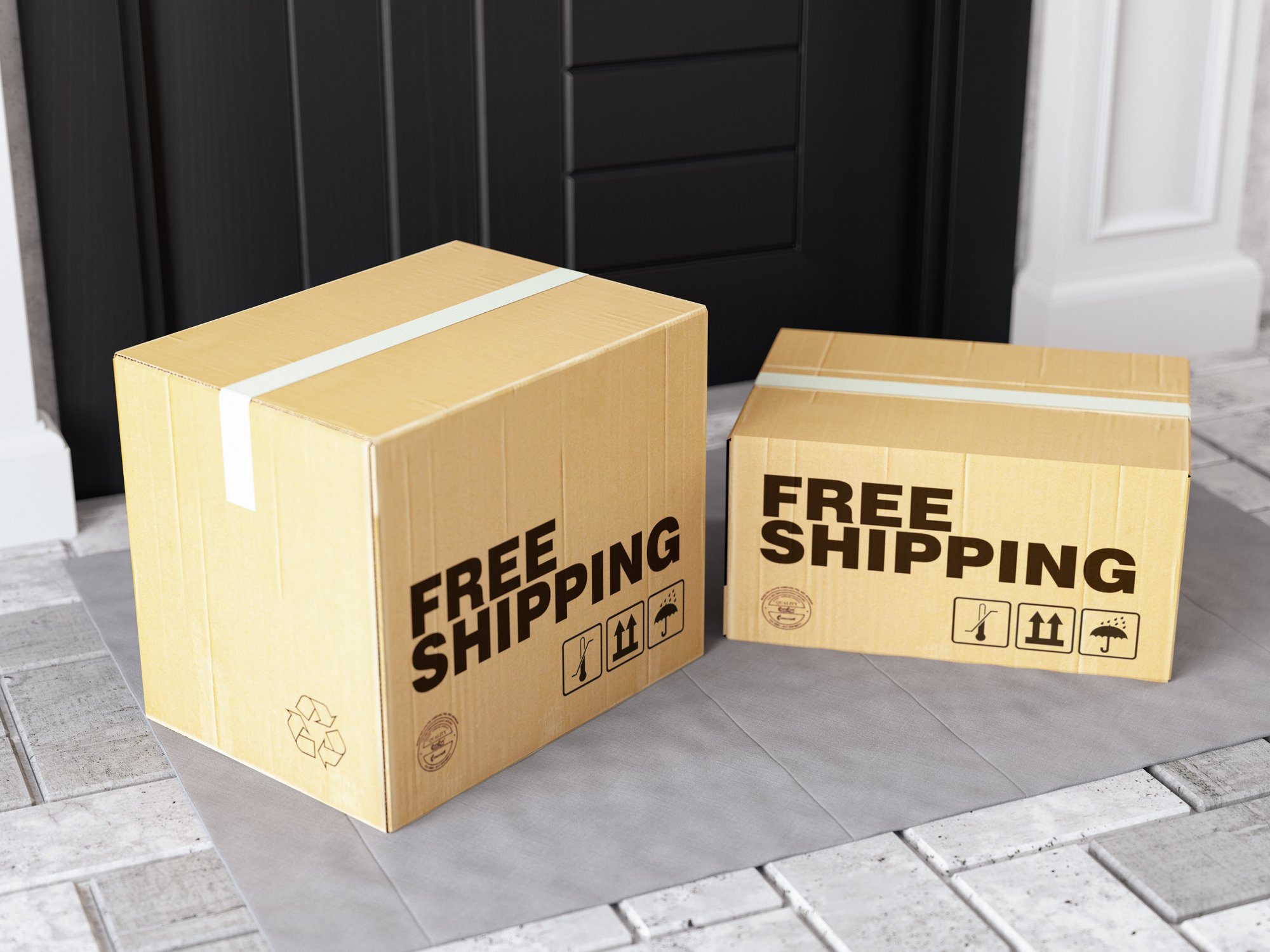 Two boxes on a doorstep that say Free Shipping on them.