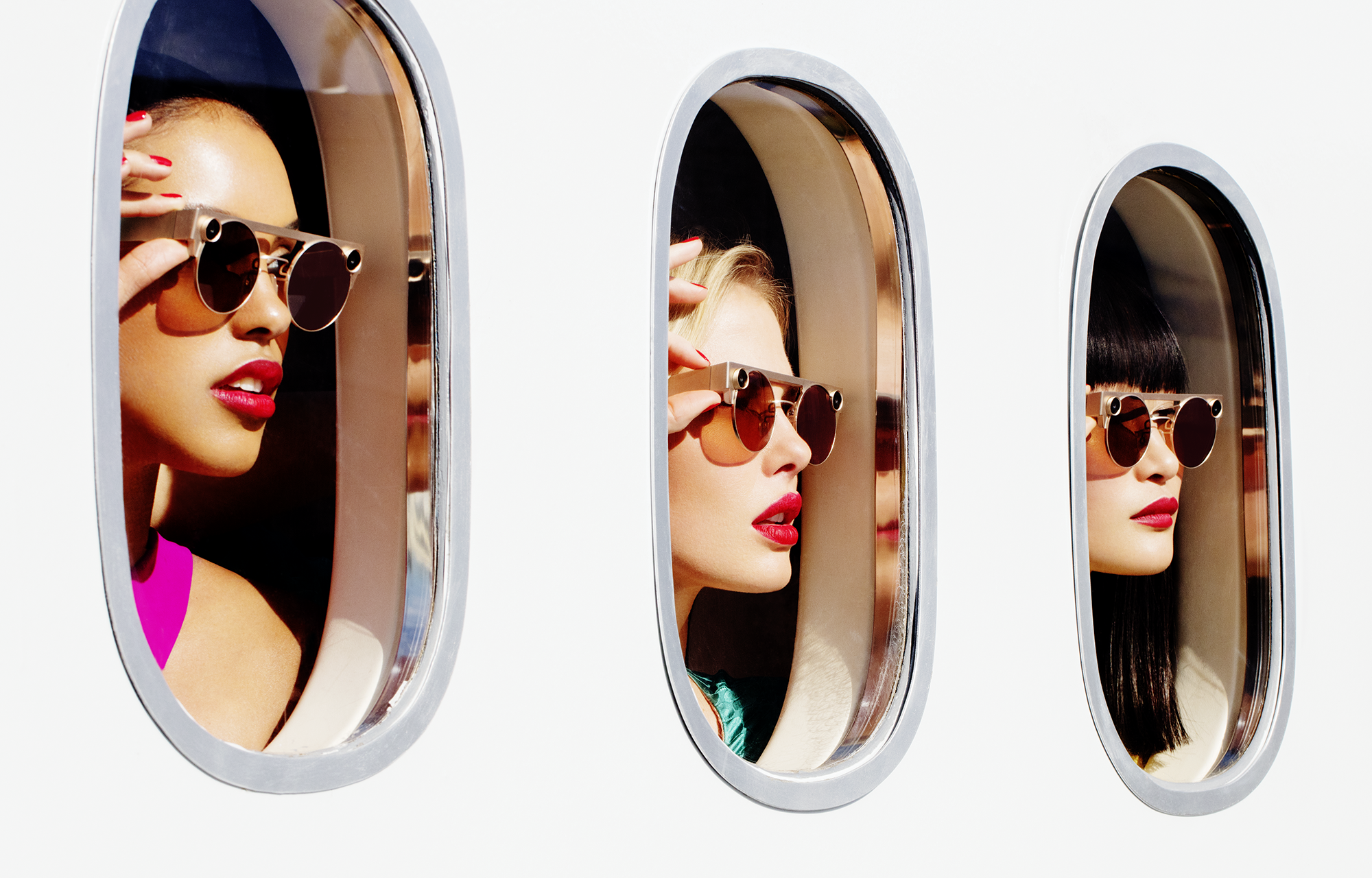 Three women wearing Spectacles looking through windows. 