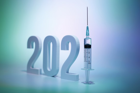 The year 2021 with a syringe and needle taking the place of the number 1.