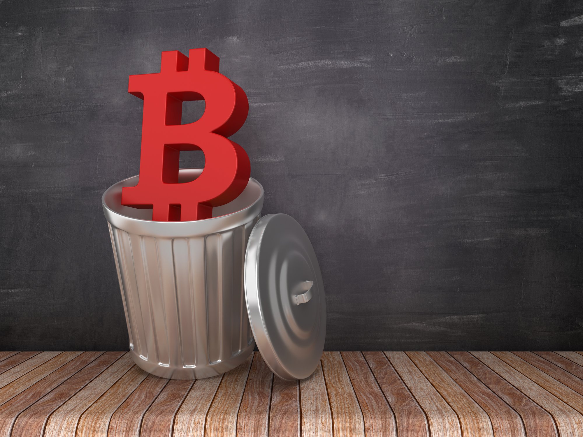 Red bitcoin symbol in a trash can.