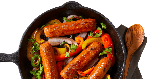 Sausages and peppers in a frying pan