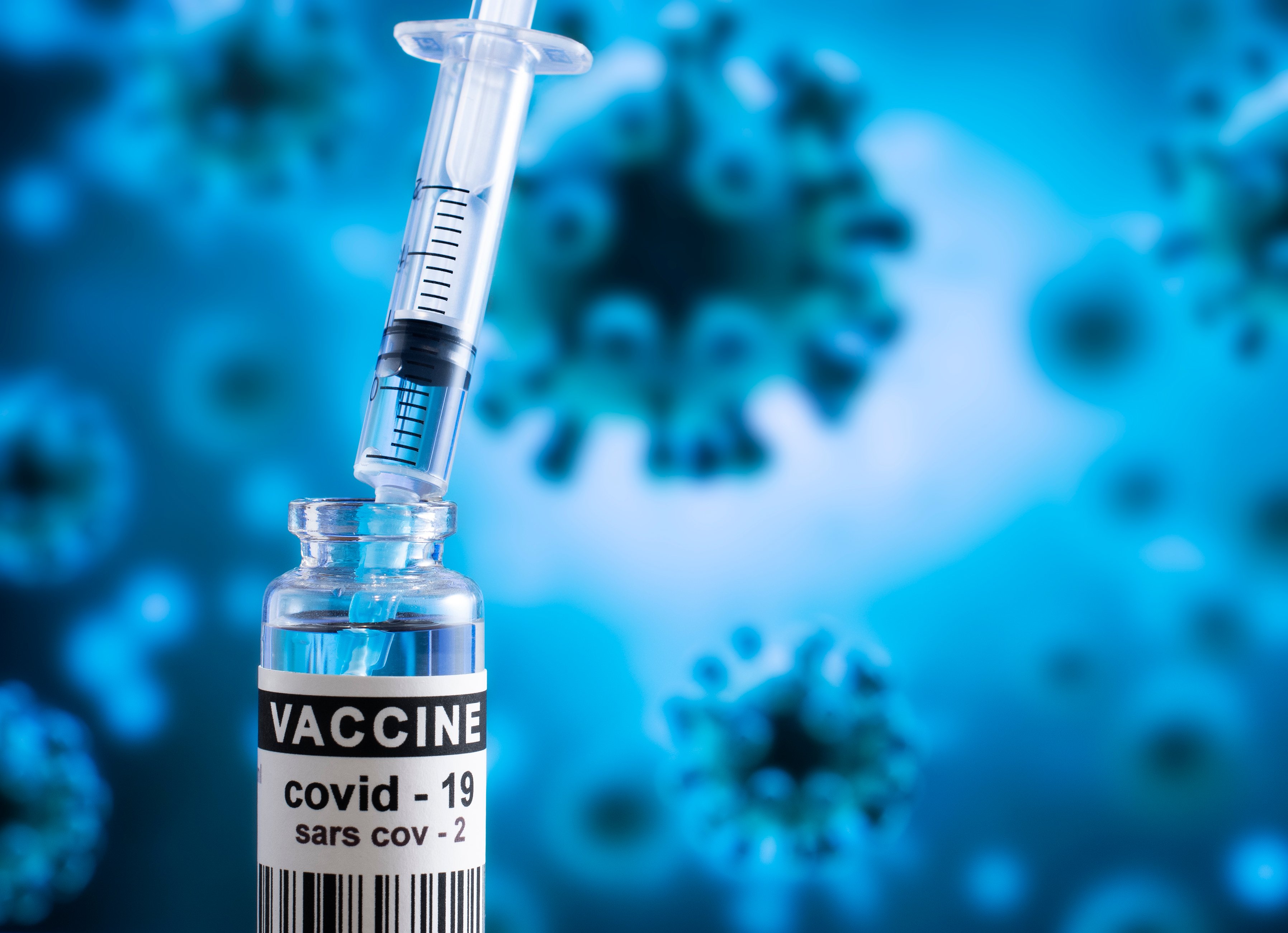 Stock photo of coronavirus vaccine vial and injection. 