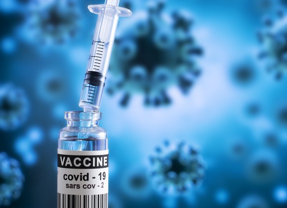 Stock photo of coronavirus vaccine vial and injection. 