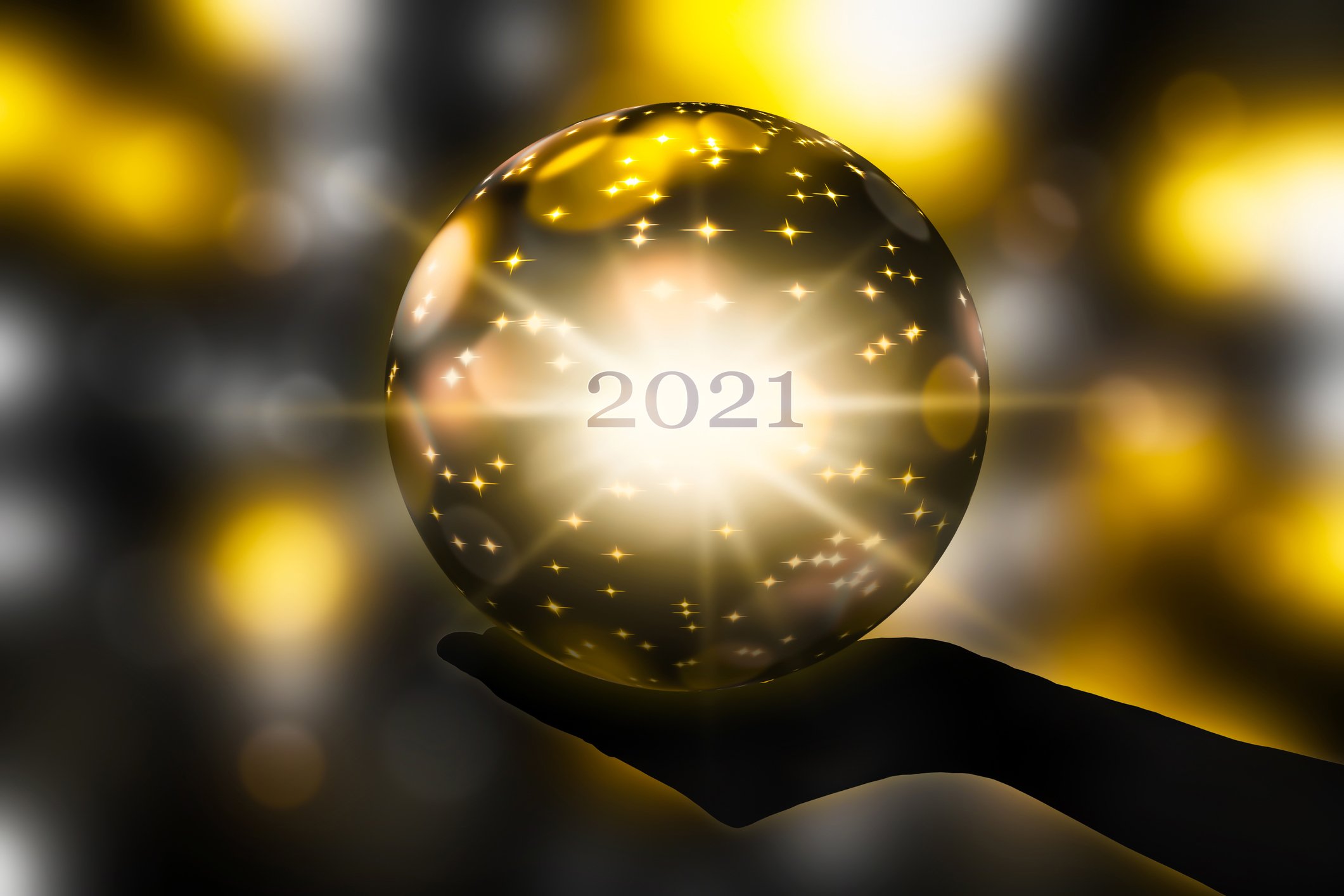 A crystal ball with 2021 inside of it.