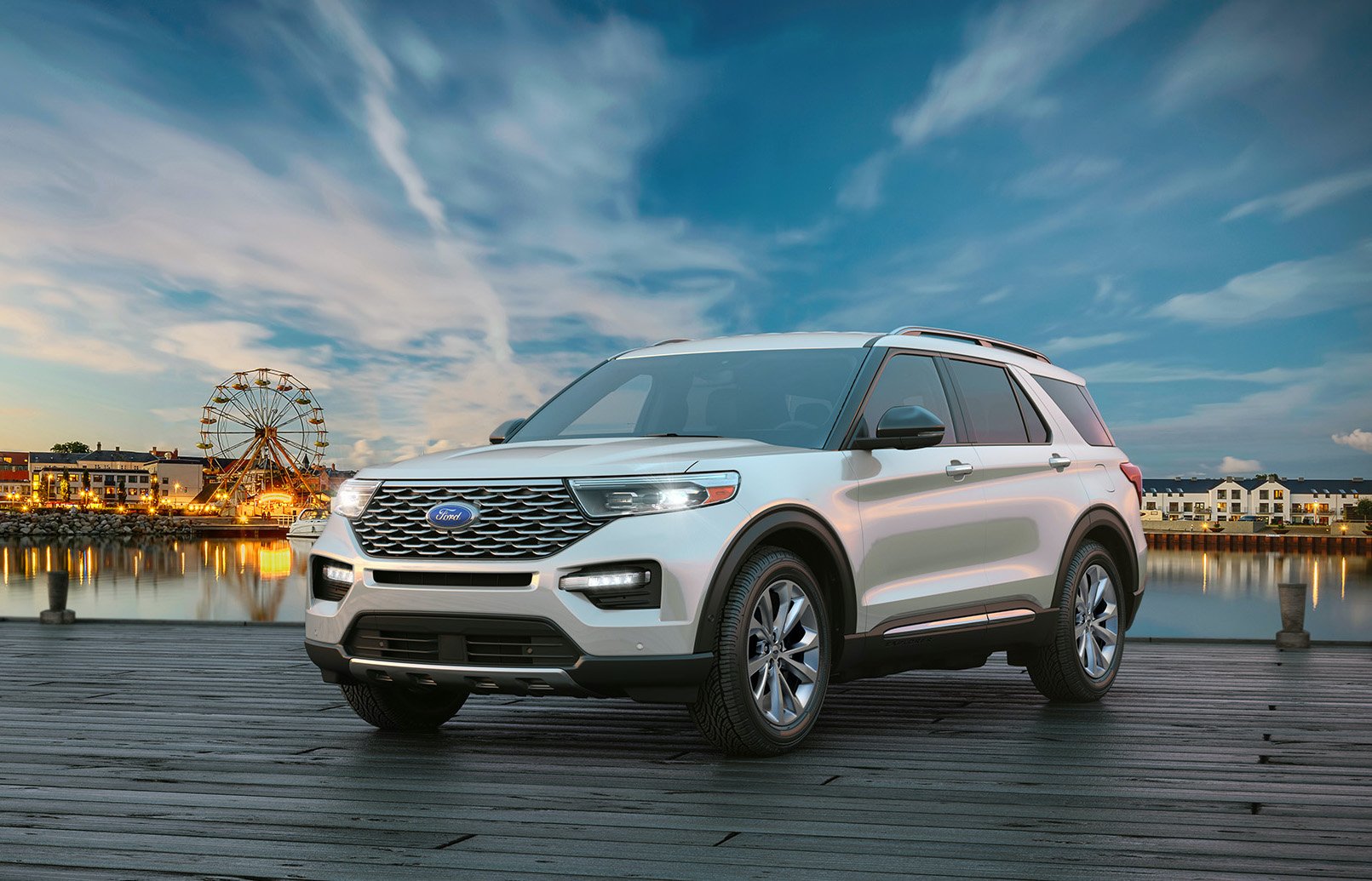 A silver 2021 Ford Explorer, a "three row" midsize crossover SUV. 