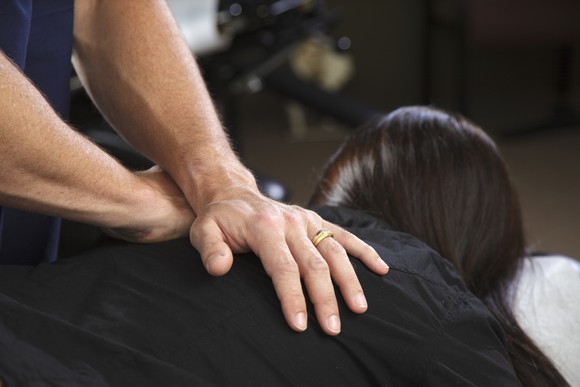 Patient receiving a chiropractic adjustment