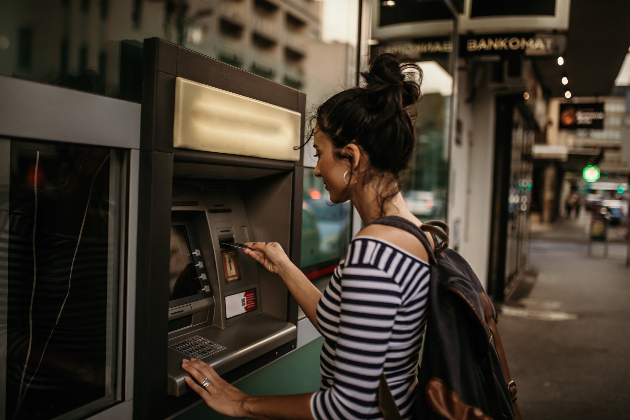 Stock photo of a woman using an ATM Getty