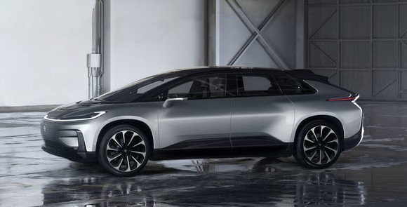 A silver FF 91 prototype, a futuristic electric luxury vehicle. 