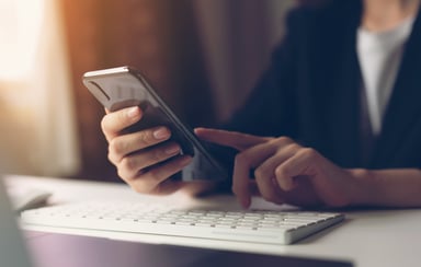 a woman holding a smartphone