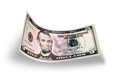 $5 bill floating on a white background