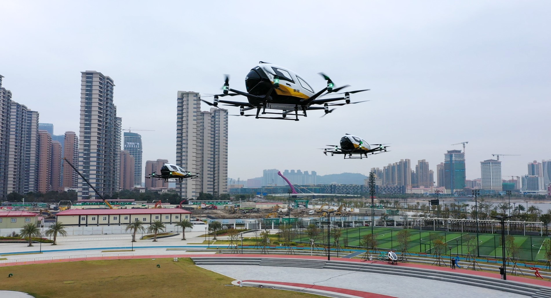 EHang EH216 AAVs in flight.