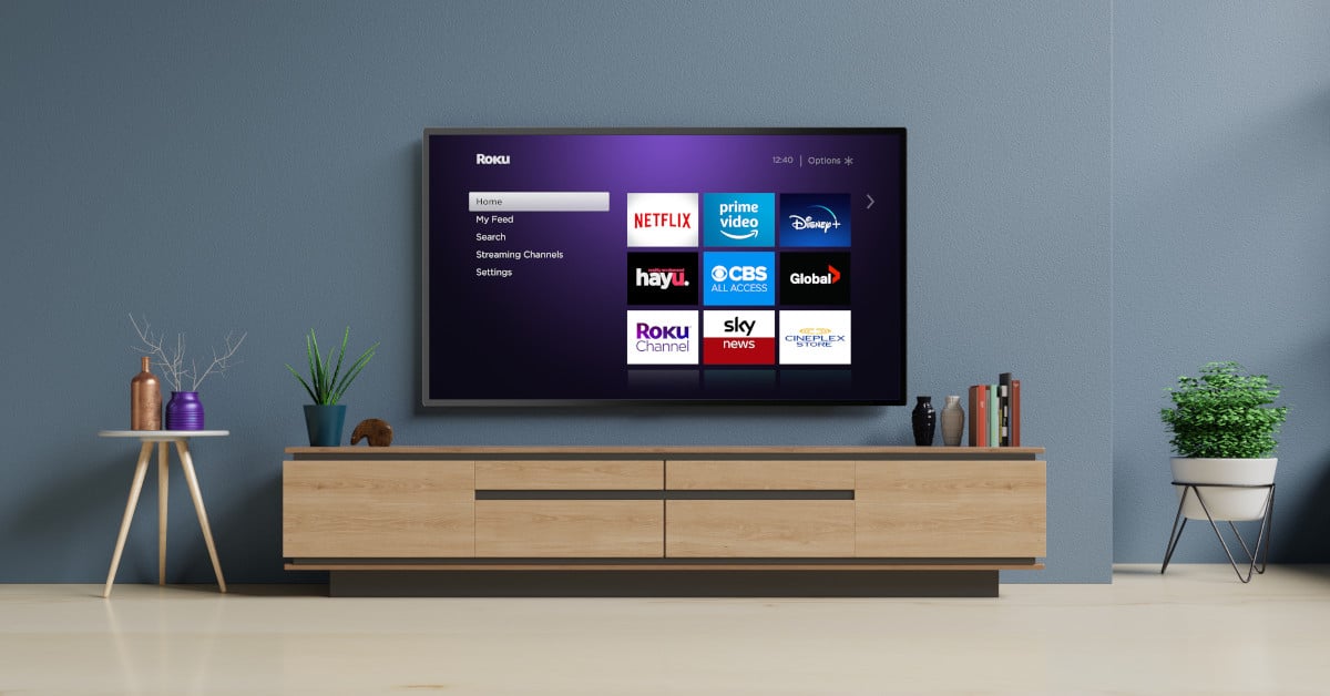 Roku TV mounted on a wall.